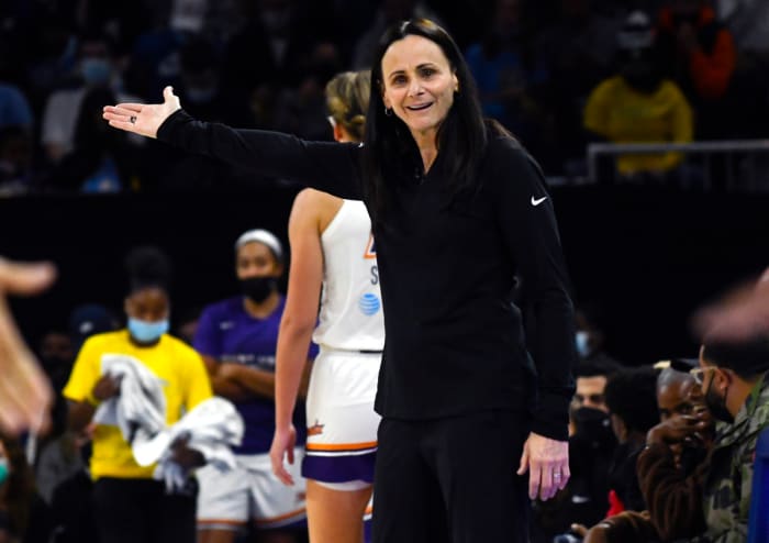 Sandy Brondello raising her right arm in confusion